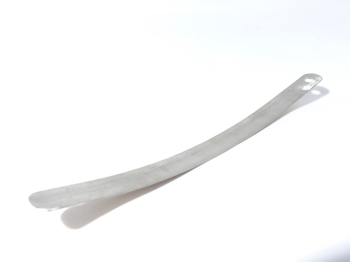 Fuxus leaf spring for hydraulic ram pump replacement part, showing the metal spring component in a close-up view.
