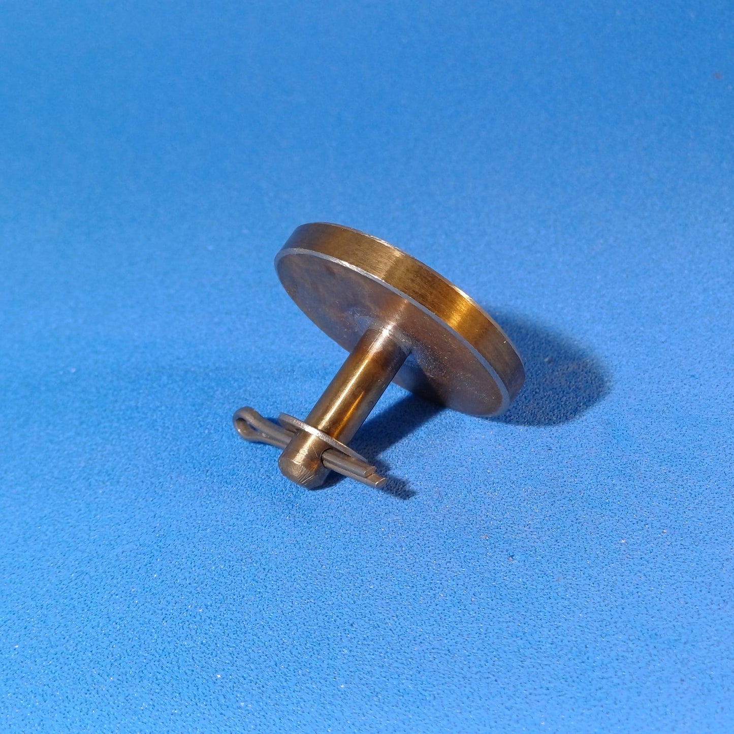 Fuxus original stainless steel valve for hydraulic ram water ram on blue background.